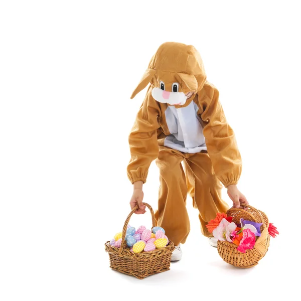 Child as easter hare with eggs and flowers — Stock Photo, Image