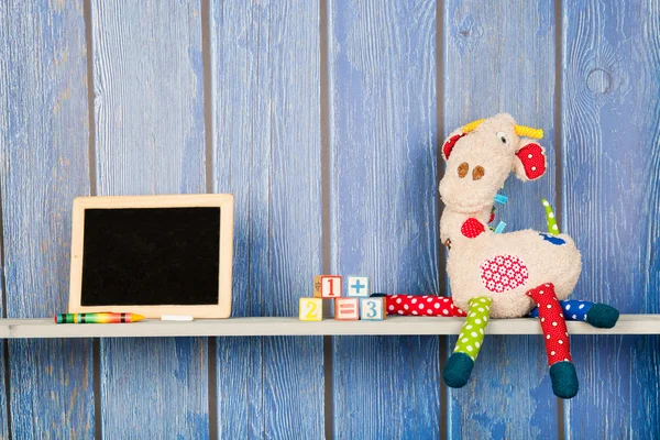 Stuffed animal giraffe in nursery — Stock Photo, Image