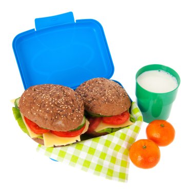 healthy brown bread roll in blue lunch box with fruit and milk clipart