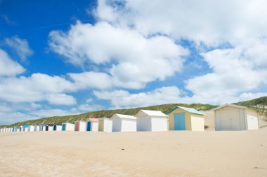 Blue beach huts at Texel clipart