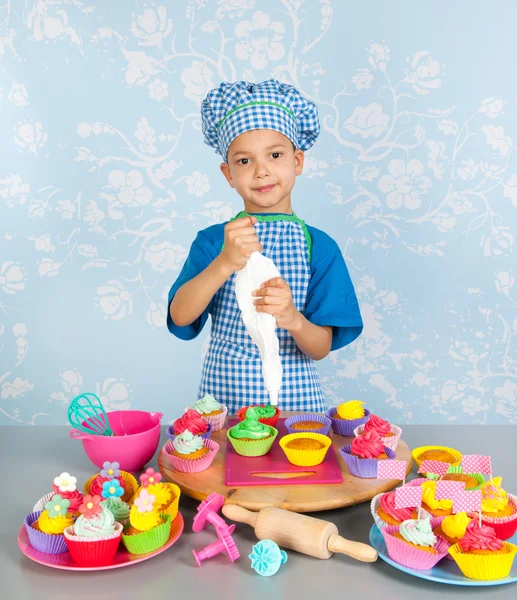 Little boy baking cupcakes — Stock Photo, Image