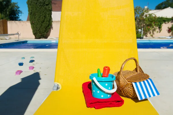 Yellow bed at swimming pool — Stock Photo, Image