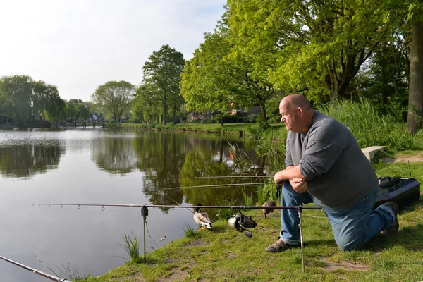 Fisherman with fishing rods — Stock Photo, Image