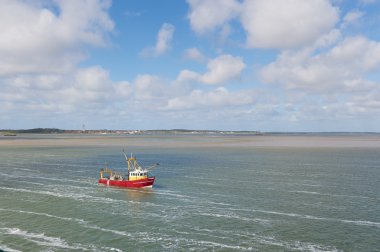 Dutch fishing boat at wadden sea clipart