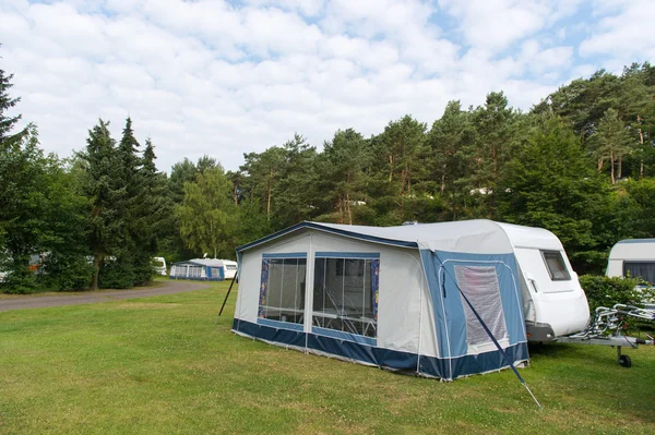 Caravan and shelter at the camping — Stock Photo, Image