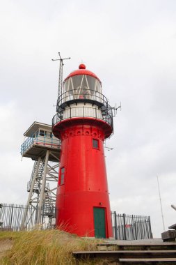Red lighthouse on Dutch wadden island Vlieland