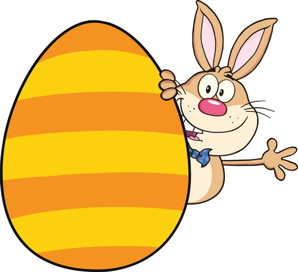 Cute Rabbit Cartoon Character Waving Behind Easter Egg — Stock Photo, Image