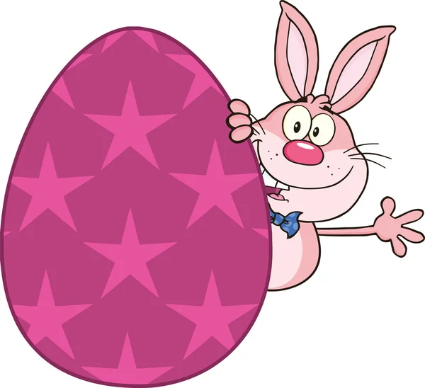 Cute Pink Rabbit Cartoon Character Waving Behind Easter Egg — Stock Photo, Image