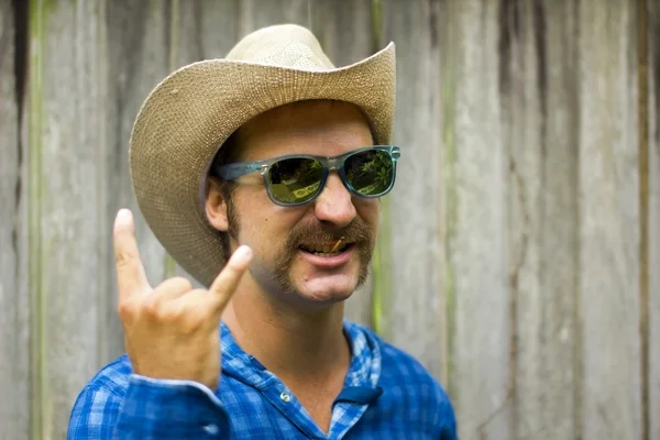 Cowboy on wooden background — Stock Photo, Image