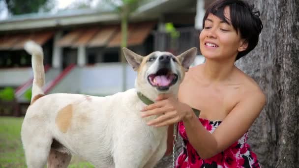 Asian woman exercise her dog — Stock Video