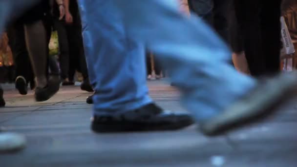 Pedestrians walking on pavement — Stock Video