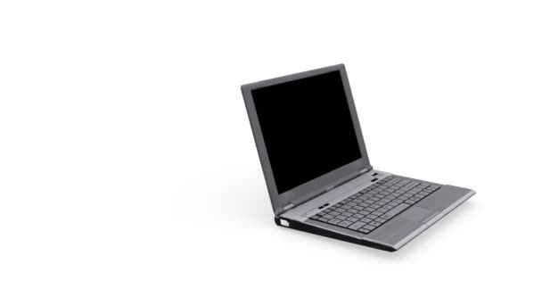 Laptop che gira su sfondo bianco — Video Stock