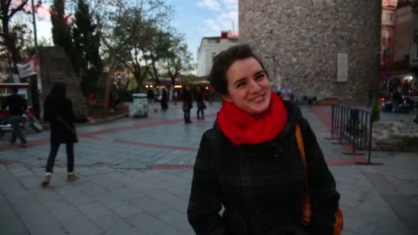 Cool woman standing at galata tower — Stock Video