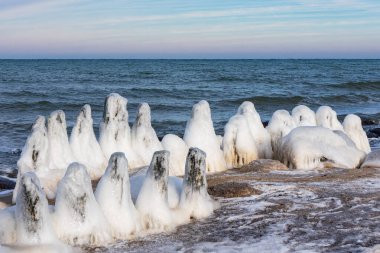 Groyne in wintertime on the Baltic Sea coast near Kuehlungsborn, Germany.