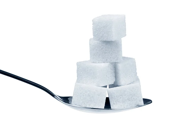 Un cucchiaio di cubetti di zucchero — Foto Stock