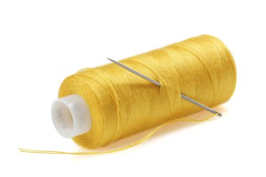 Sarı bobin iplik iğne ile