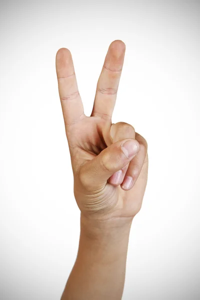 Hand showing the sign of victory and peace c — Stock Photo, Image