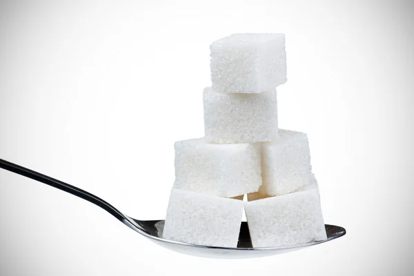 A spoonful of sugar cubes — Stock Photo, Image