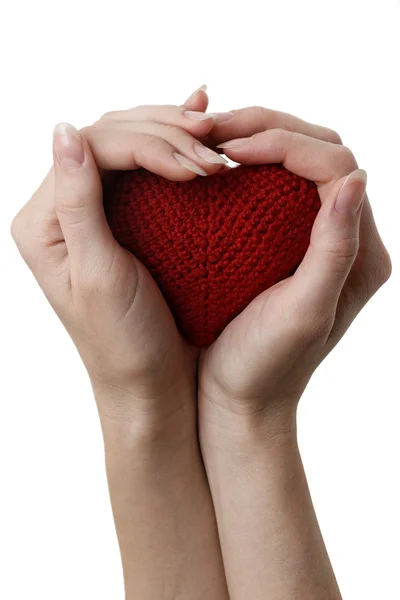 Holding a red heart in hands — Stock Photo, Image