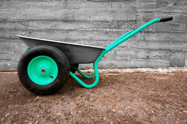 Modern green wheelbarrow — Stock Photo, Image