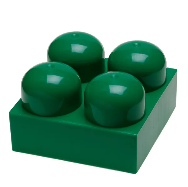 Grote groene plastic speelgoed blok — Stockfoto