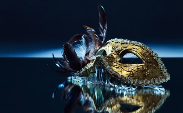 Venetian mask with feather — Stock Photo, Image