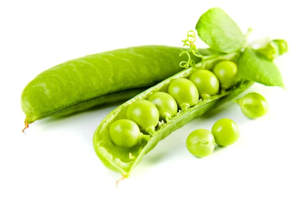 Green peas on a white background — Stock Photo, Image