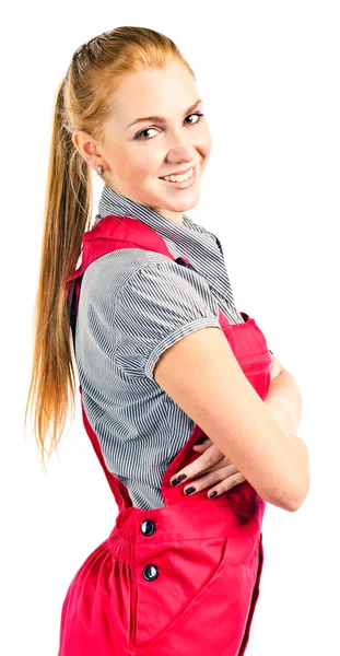 Young happy woman in red overalls — Stock Photo, Image