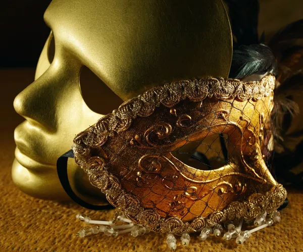 Old golden Venetian masks , focus on a center — Stock Photo, Image