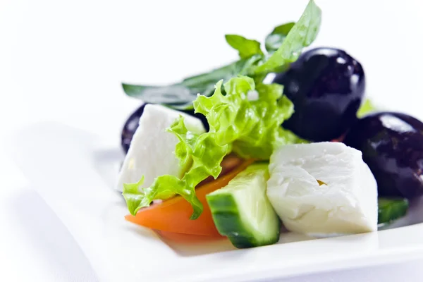 Salad with cheese and black olives — Stock Photo, Image