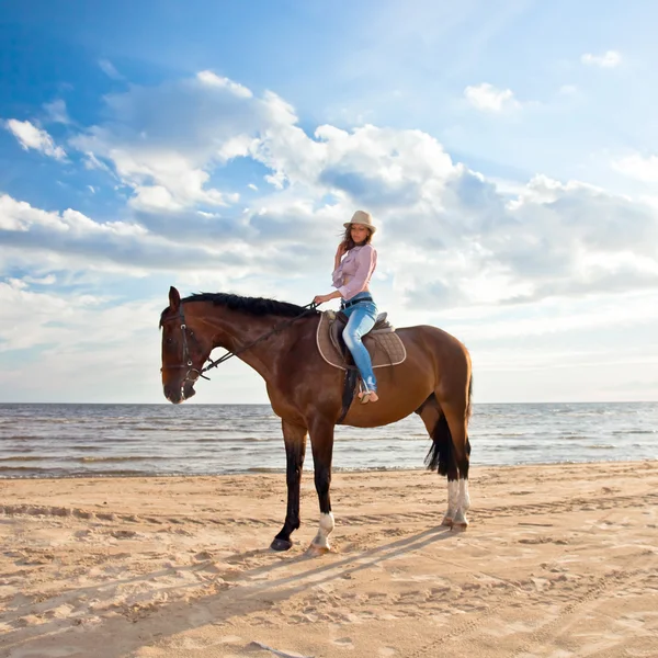 Girl with horse on seacoast — Stock Photo, Image