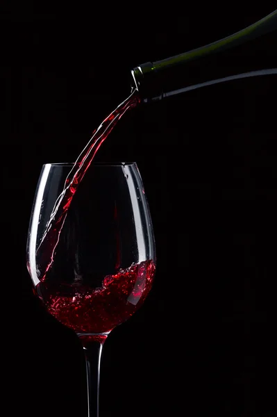 Bottle and glass with red wine — Stock Photo, Image