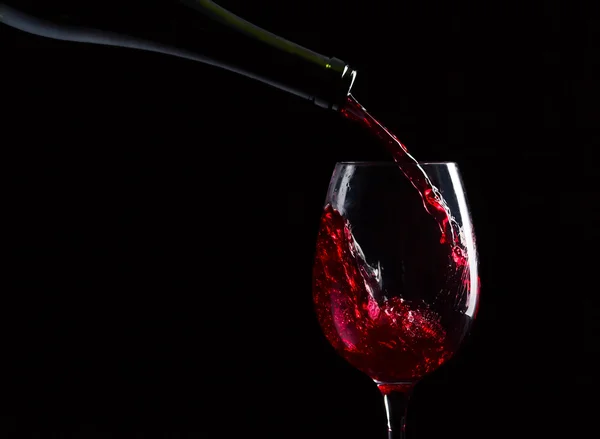 Bottle and glass with red wine — Stock Photo, Image