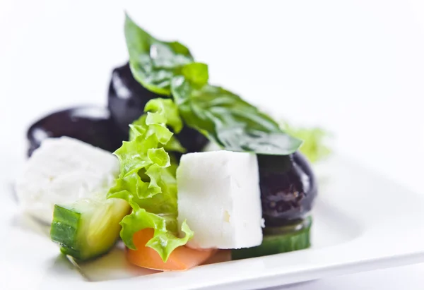 Salad with cheese and black olives — Stock Photo, Image
