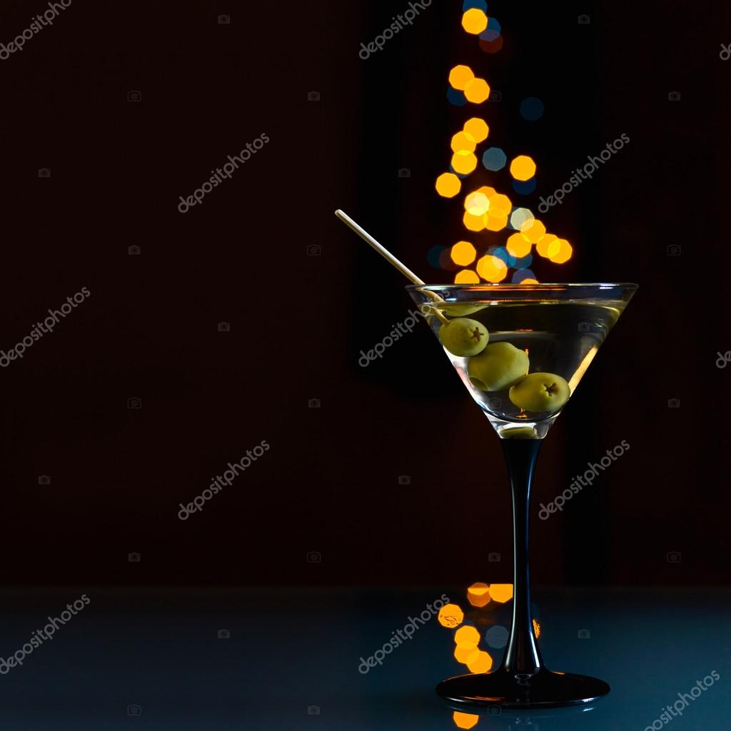 A Martini Glass On A Black Background Stock Photo - Download Image