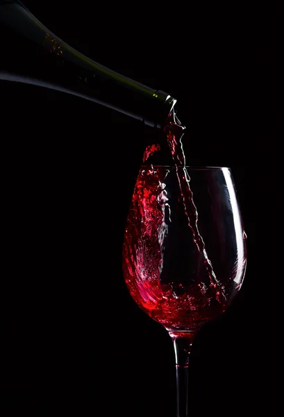 Bottle and glass with red wine — Stock Photo, Image