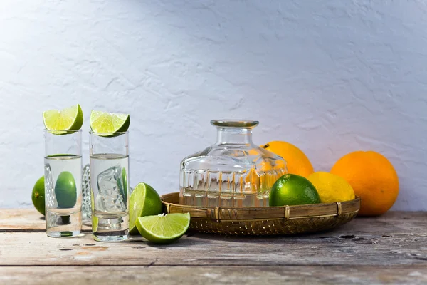 Tequila and citrus fruits — Stock Photo, Image