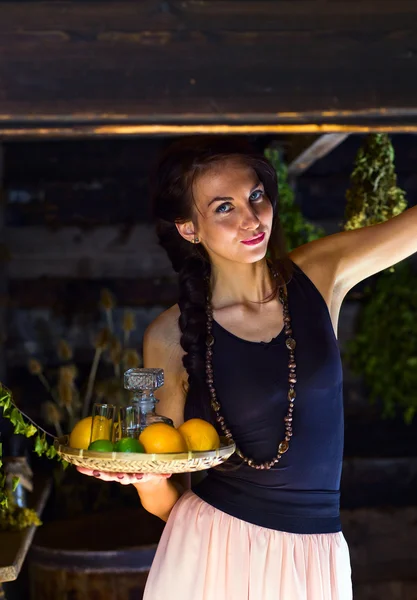 Young beautiful woman with tequila and citrus — Stock Photo, Image