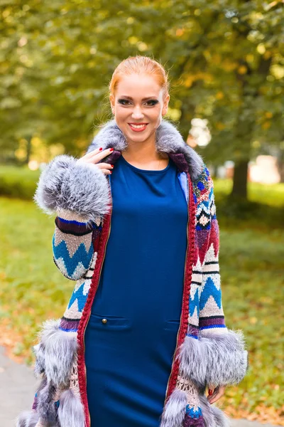 Girl in a knitted coat — Stock Photo, Image