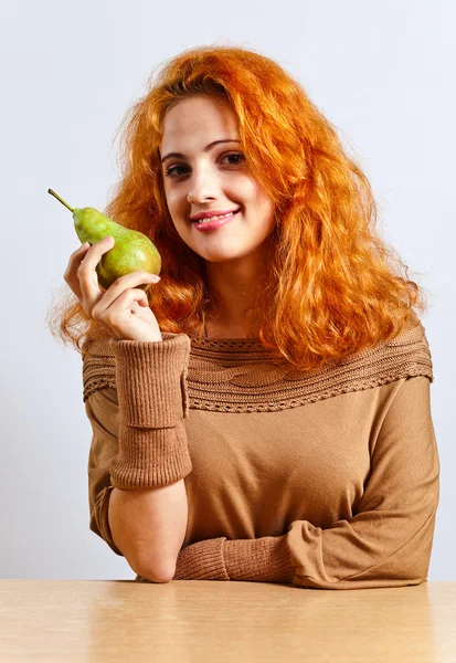Young woman with big pear — Stock Photo, Image