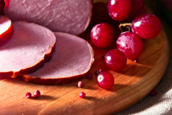 Smoked meat and red grape — Stock Photo, Image