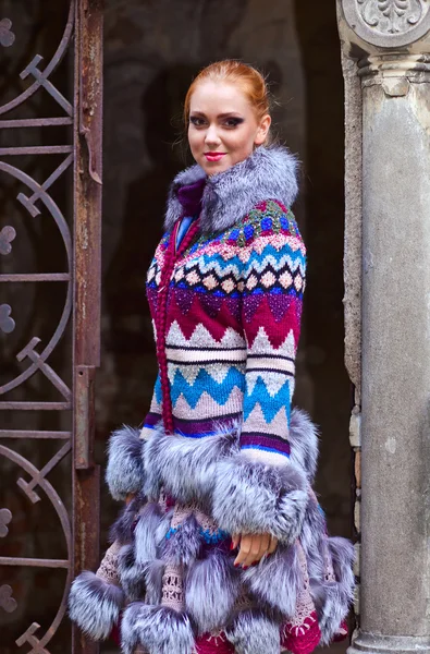 Girl in a knitted coat — Stock Photo, Image