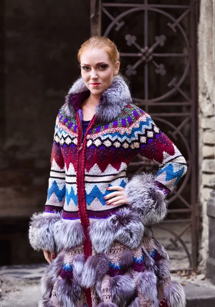 Girl in a knitted coat — Stock Photo, Image