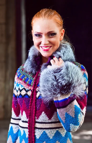 Girl in a knitted coat — Stock Photo, Image