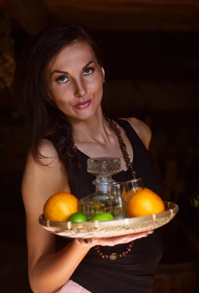 Young beautiful woman with tequila and citrus — Stock Photo, Image