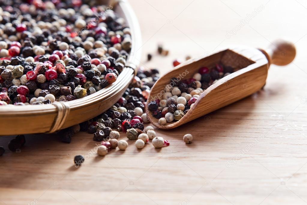  peppercorns on wooden table