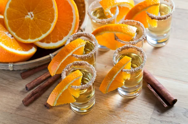 Tequila with orange and cinnamon — Stock Photo, Image