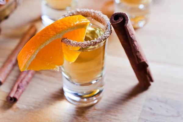 Tequila with orange and cinnamon — Stock Photo, Image