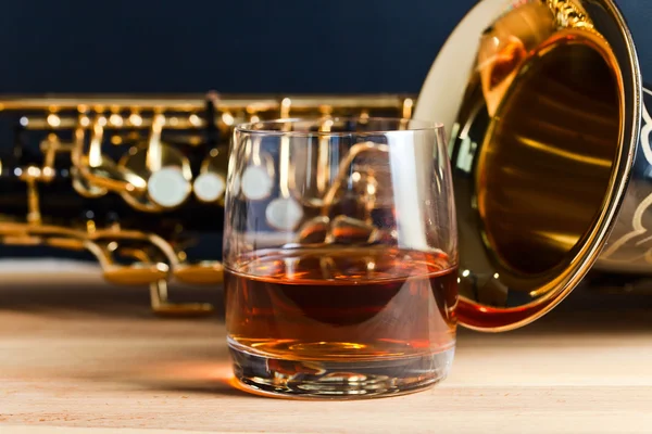 Saxophone and whiskey — Stock Photo, Image