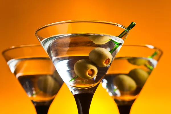 Glasses with martini and green olives — Stock Photo, Image